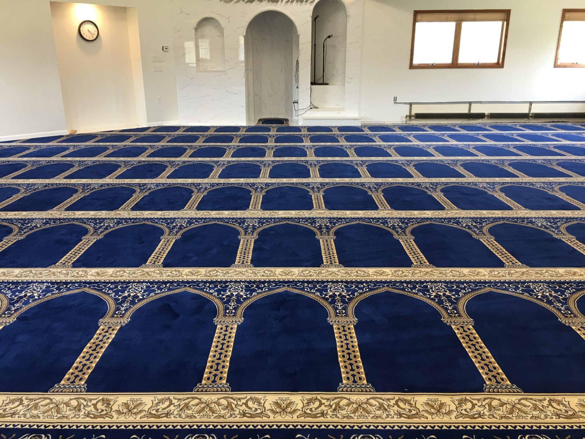 Beautifully designed masjid flooring with premium carpets offering comfort, durability, and a serene prayer atmosphere.